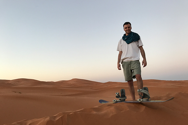 Sandboarding in the desert near Merzouga, Morocco